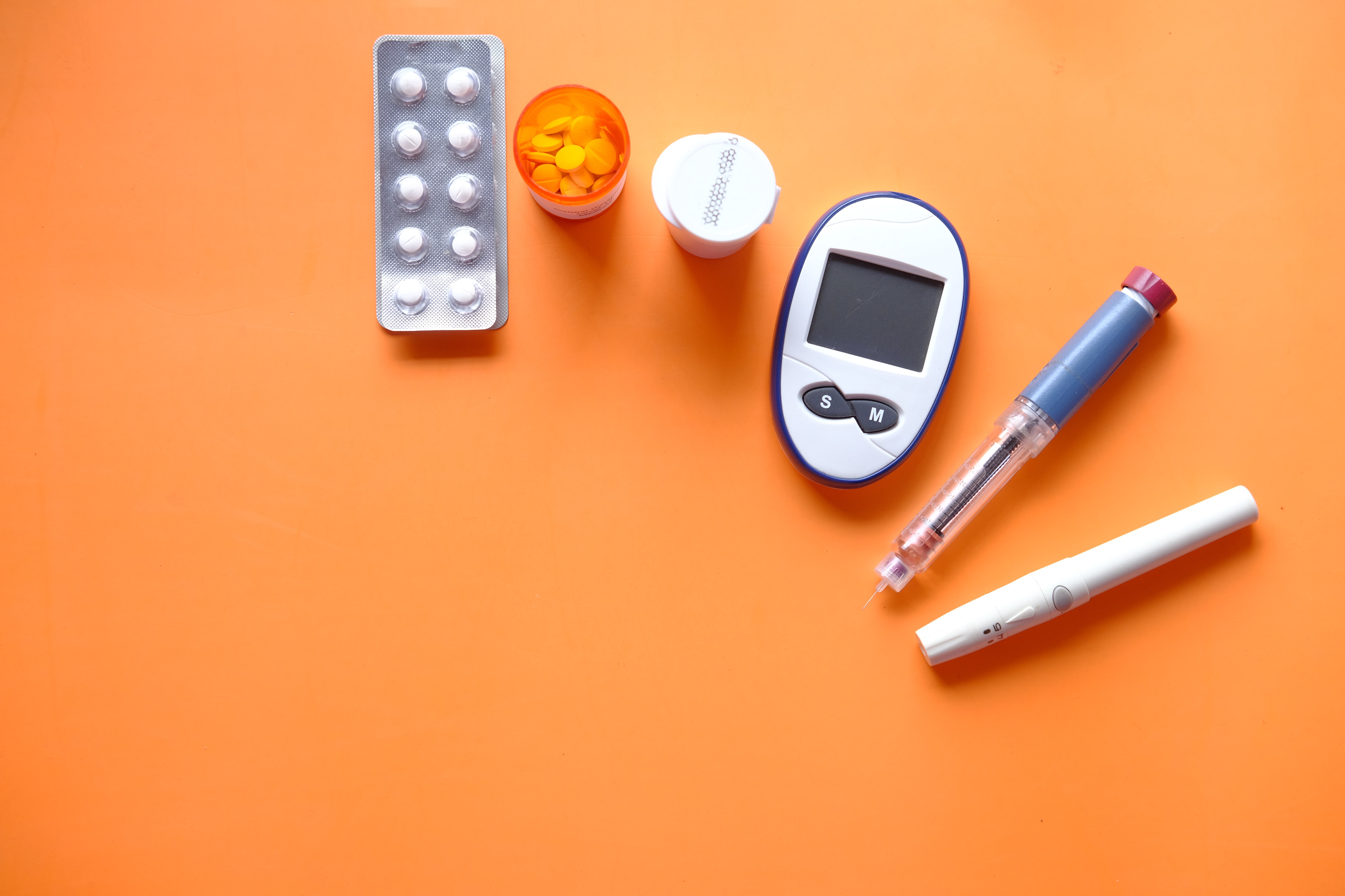 pills, white pen and digital device